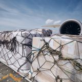 cargo-containers-against-jet-engine-of-freight-airplane.jpg