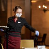 responsible-woman-in-protective-mask-working-at-restaurant-e1706515470633.jpg