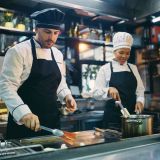 two-professional-cooks-working-in-the-kitchen-at-restaurant-e1706519791942.jpg