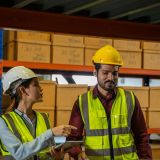 warehouse-worker-checking-goods-and-supplies-on-shelves-with-goods-background-e1705513074959.jpg