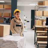 young-adult-filming-advertisement-video-in-stockroom-e1702748415917.jpg